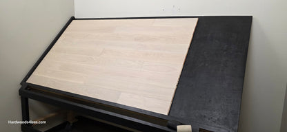 5" x 9/16" Engineered European Oak Vail Hardwood Flooring. Shown on a black shooting table. Shot from wide right.