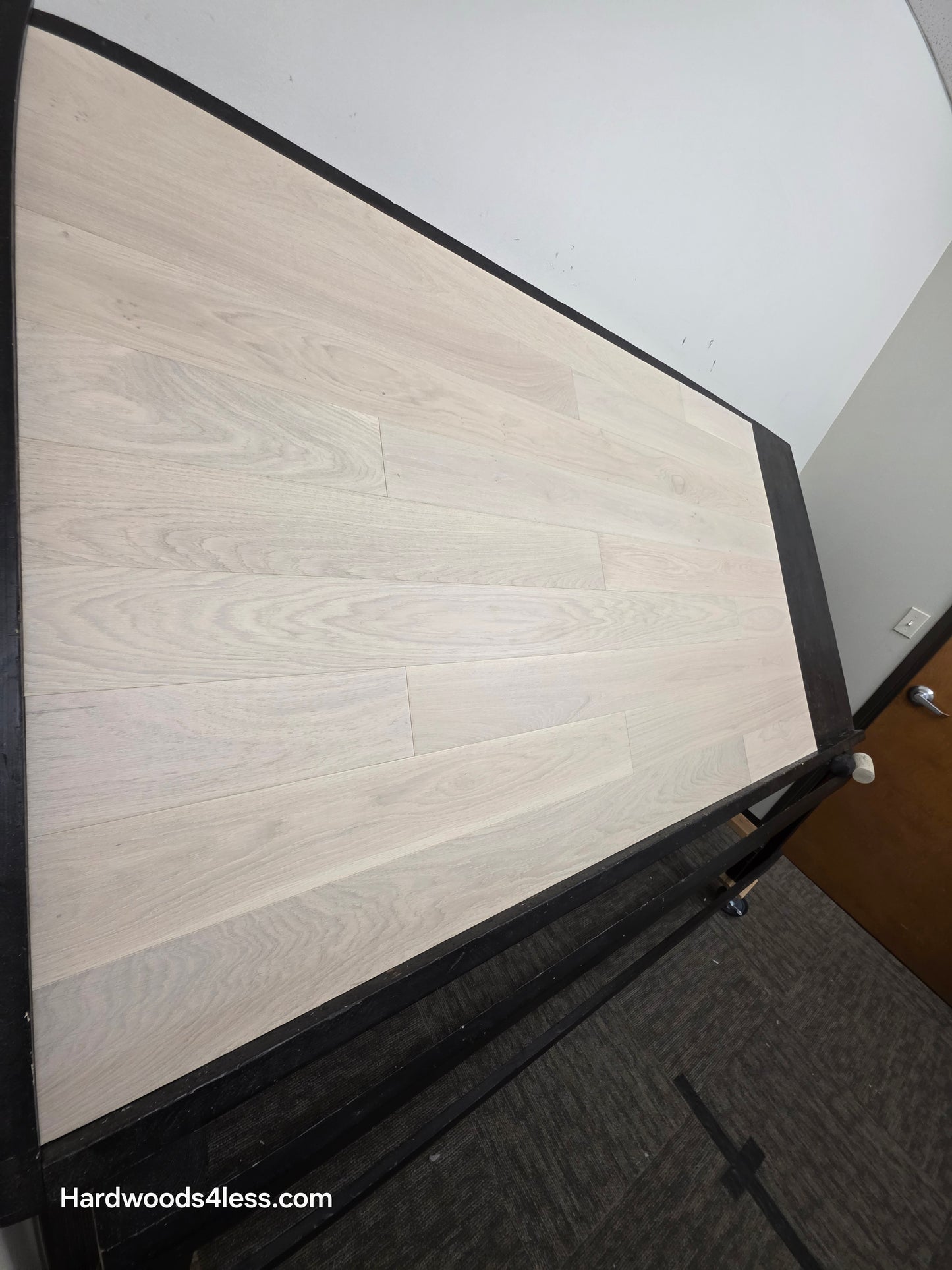 5" x 9/16" Engineered European Oak Vail Hardwood Flooring. Shown on a black shooting table. Shot from steep left. 