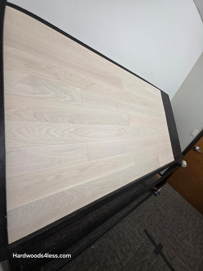 5" x 9/16" Engineered European Oak Vail Hardwood Flooring. Shown on a black shooting table. Shot from steep left. 