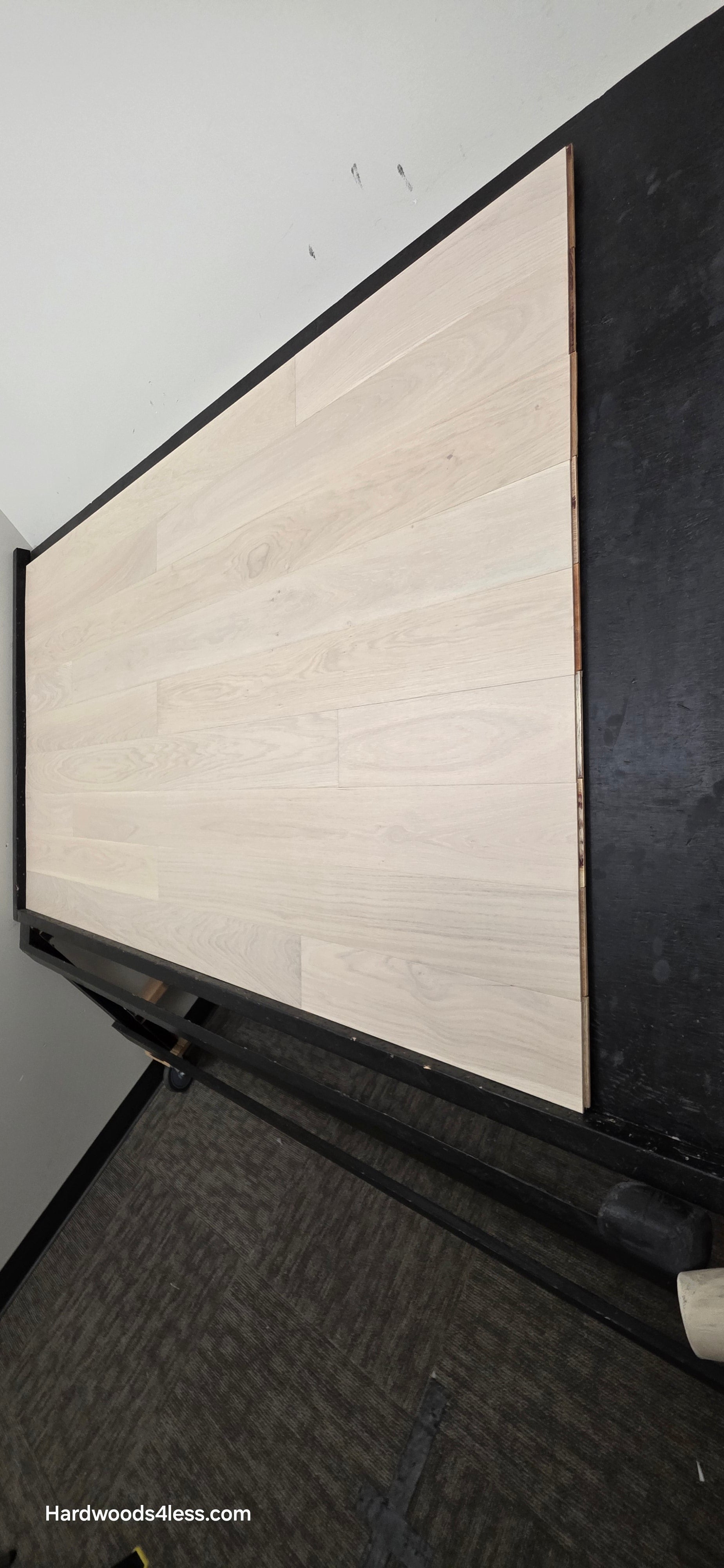 5" x 9/16" Engineered European Oak Vail Hardwood Flooring. Shown on a black shooting table. Shot from steep right. 