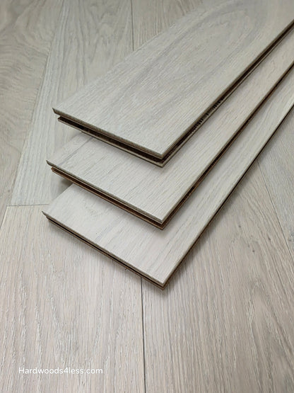 5" x 9/16" Engineered European Oak Vail Hardwood Flooring. Shown as 3 tiles stacked on the floor. 