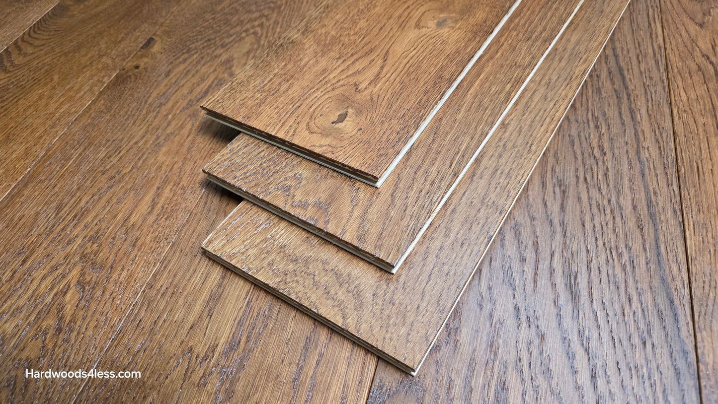 6 1/2" x 1/2" Engineered European White Oak Old Fashioned Hardwood Flooring. Shown as 3 planks stacked atop the flooring. 
