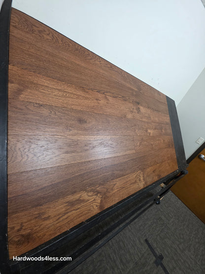 6 1/2" x 1/2" Engineered European White Oak Old Fashioned Hardwood Flooring. Shown on a black shooting table. Shot from steep left. 