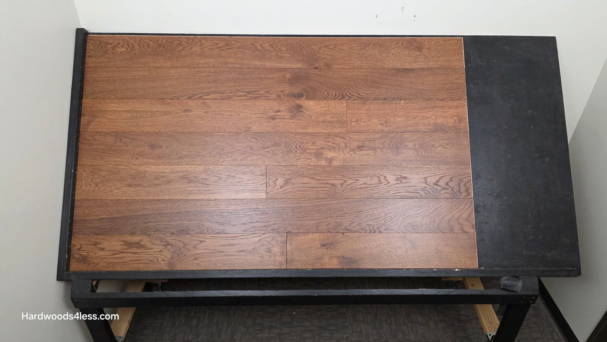 6 1/2" x 1/2" Engineered European White Oak Old Fashioned Hardwood Flooring. Shown on a black shooting table. Shot from center.