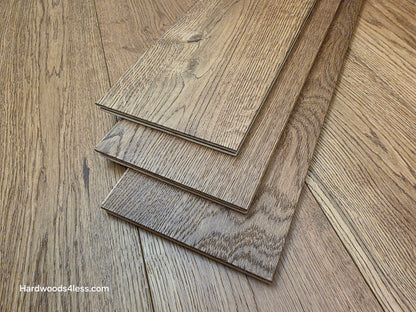 6 1/2" x 1/2" Engineered European White Oak Tequila Sunrise Hardwood Flooring. Shown as 3 tiles stacked atop the floor. 