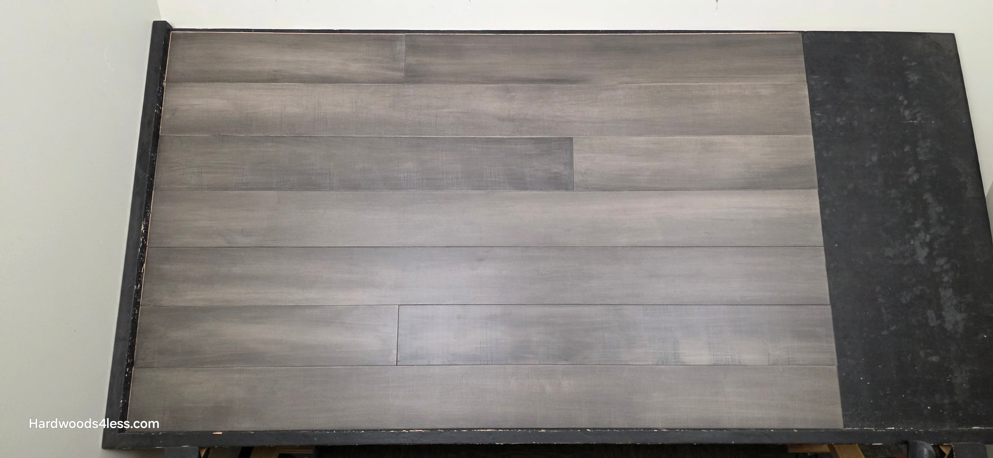 6 1/2" x 1/2" Engineered Maple Autumn Ash Hardwood Flooring. Shown on a black shooting table