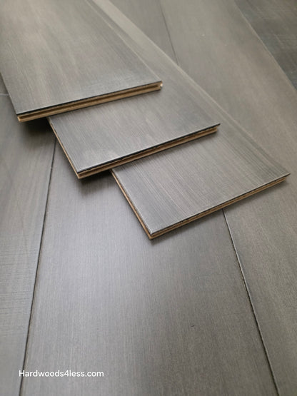 6 1/2" x 1/2" Engineered Maple Autumn Ash Hardwood Flooring shown with 3 boards stacked atop the flooring