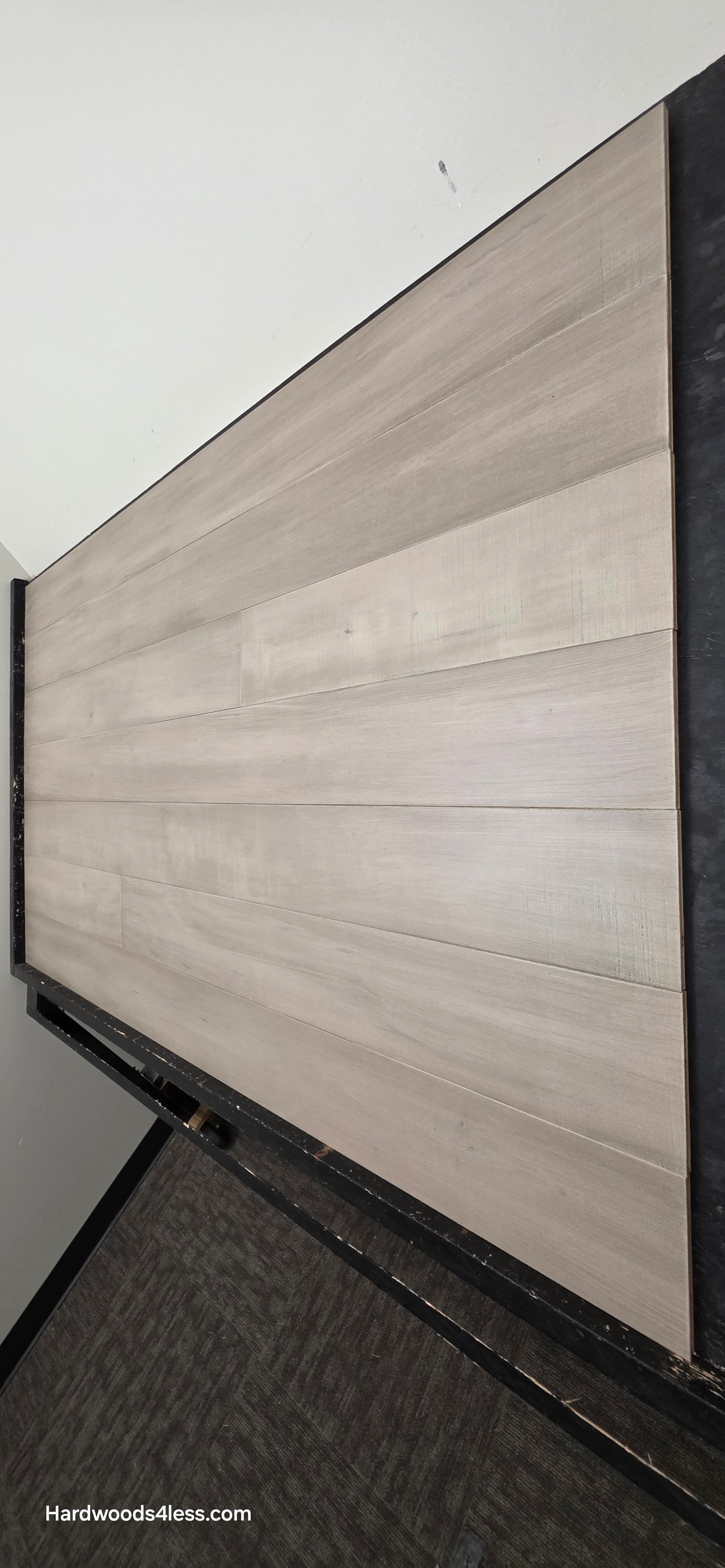 6 1/2" x 1/2" Engineered Maple Polar Palace Hardwood Flooring shown on a black shooting table.