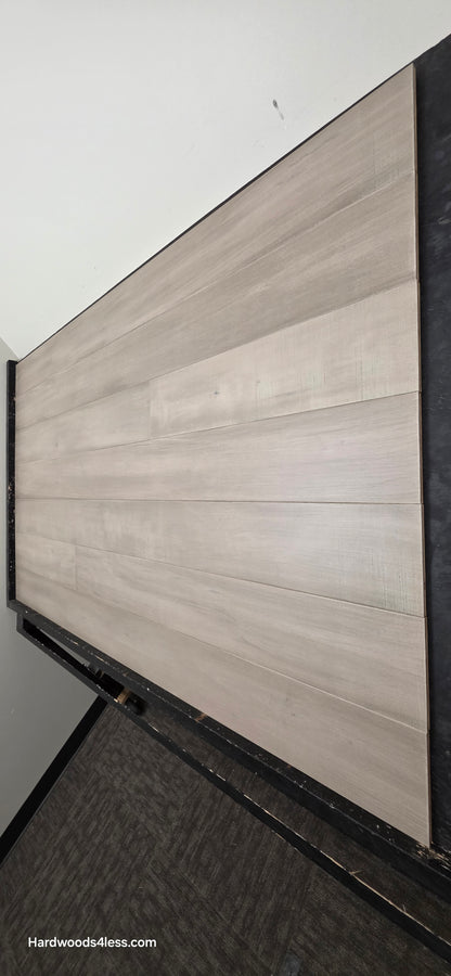 6 1/2" x 1/2" Engineered Maple Polar Palace Hardwood Flooring shown on a black shooting table.
