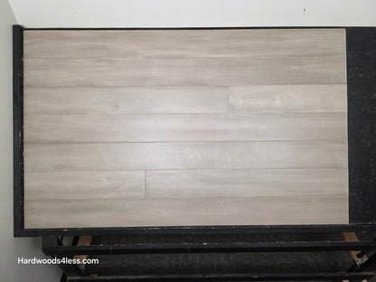 6 1/2" x 1/2" Engineered Maple Polar Palace Hardwood Flooring shown on a black shooting table.