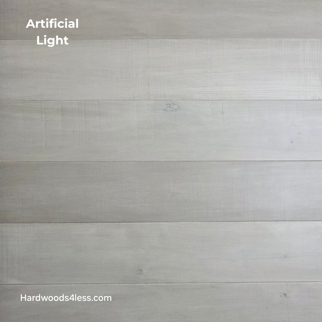 6 1/2" x 1/2" Engineered Maple Satin Sunrise Hardwood Flooring. Shown close up in artificial lighting.