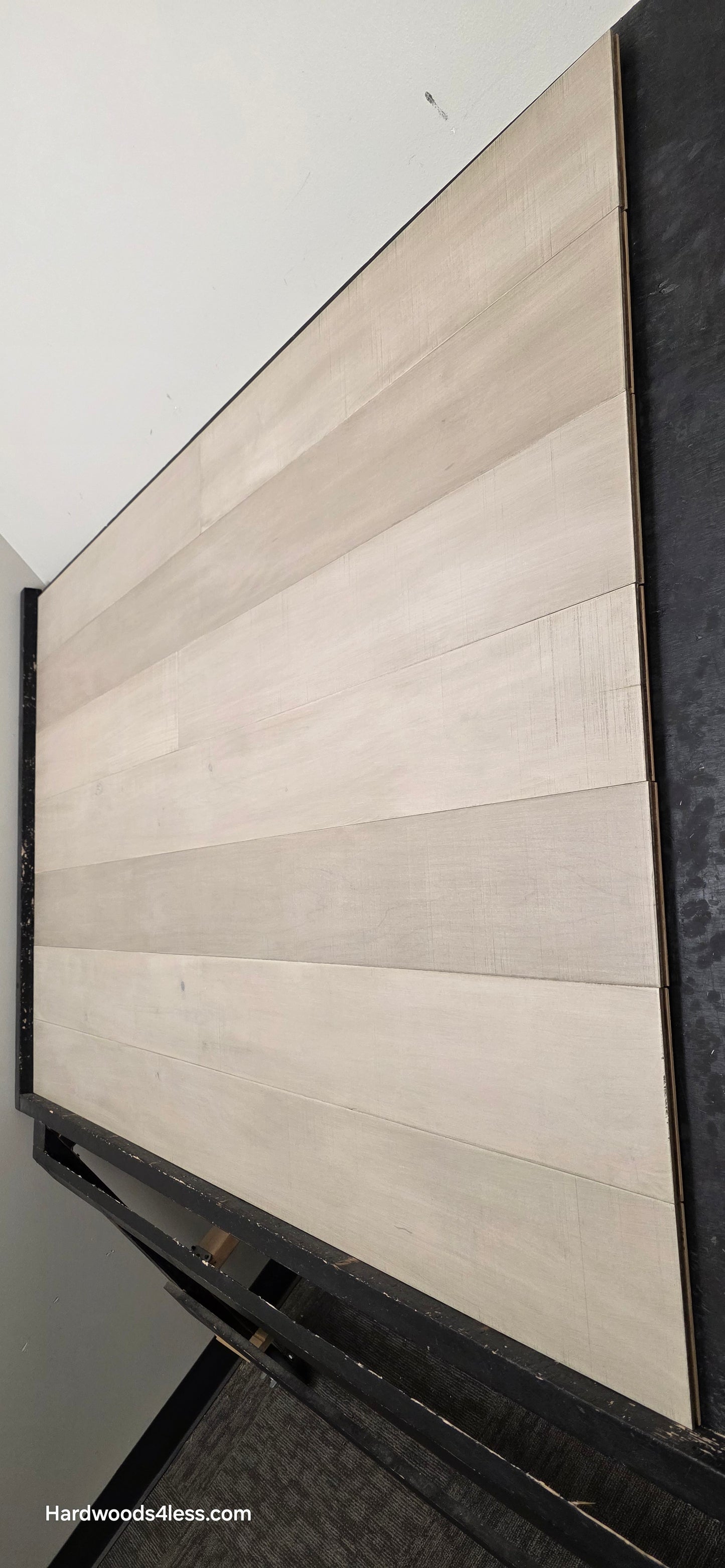 6 1/2" x 1/2" Engineered Maple Satin Sunrise Hardwood Flooring. Shown close up. Steep shot on the right side