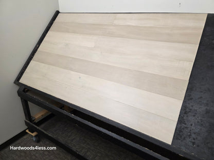 6 1/2" x 1/2" Engineered Maple Satin Sunrise Hardwood Flooring. Shown on a black shooting table right hand shot