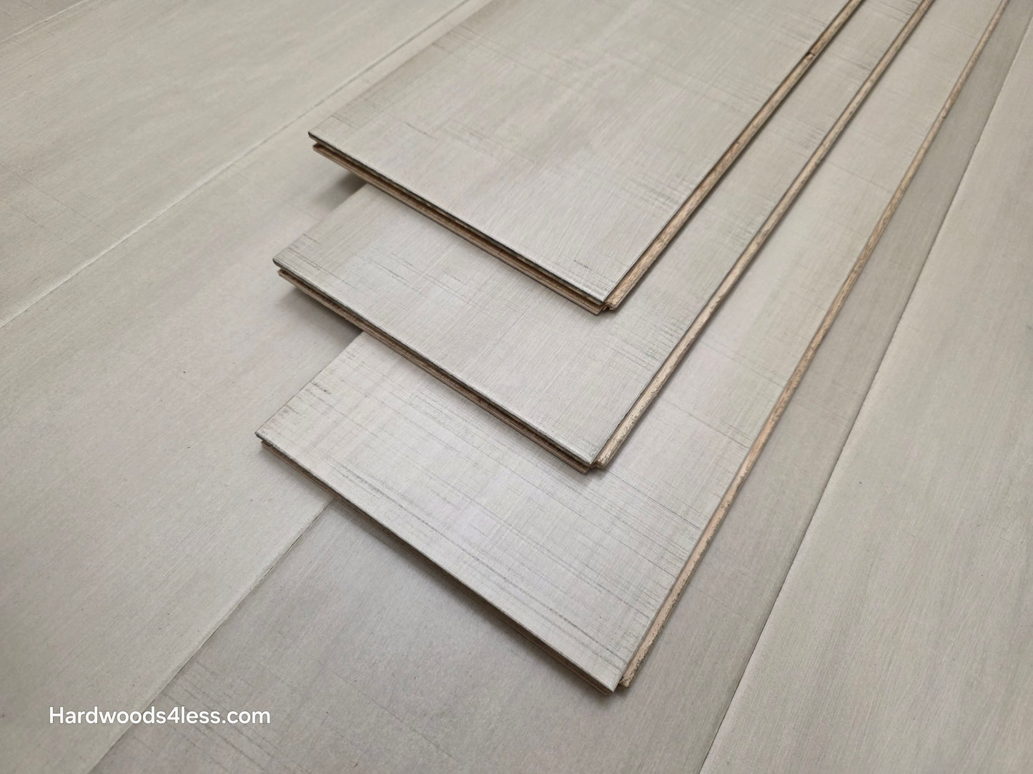 6 1/2" x 1/2" Engineered Maple Satin Sunrise Hardwood Flooring close up of three tiles stacked on each other 