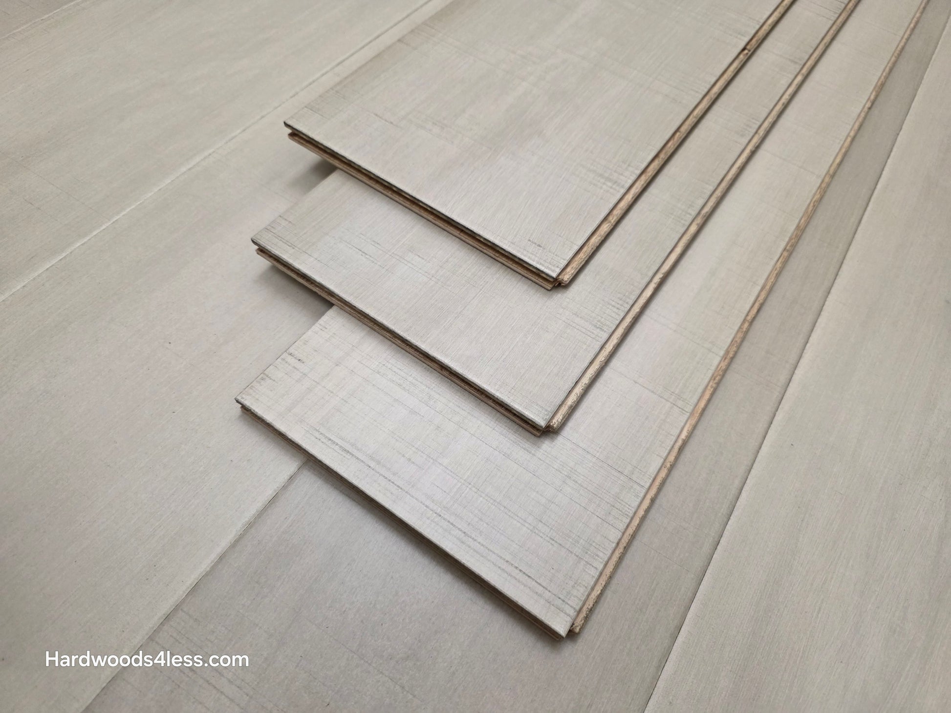 6 1/2" x 1/2" Engineered Maple Satin Sunrise Hardwood Flooring close up of three tiles stacked on each other 