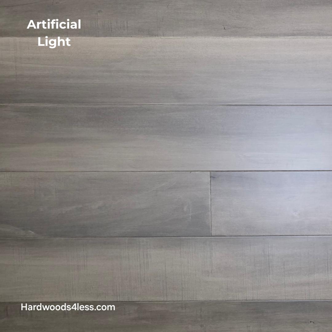 6 1/2" x 1/2" Engineered Maple Weathered Winter Hardwood Flooring. Shown in artificial lighting.