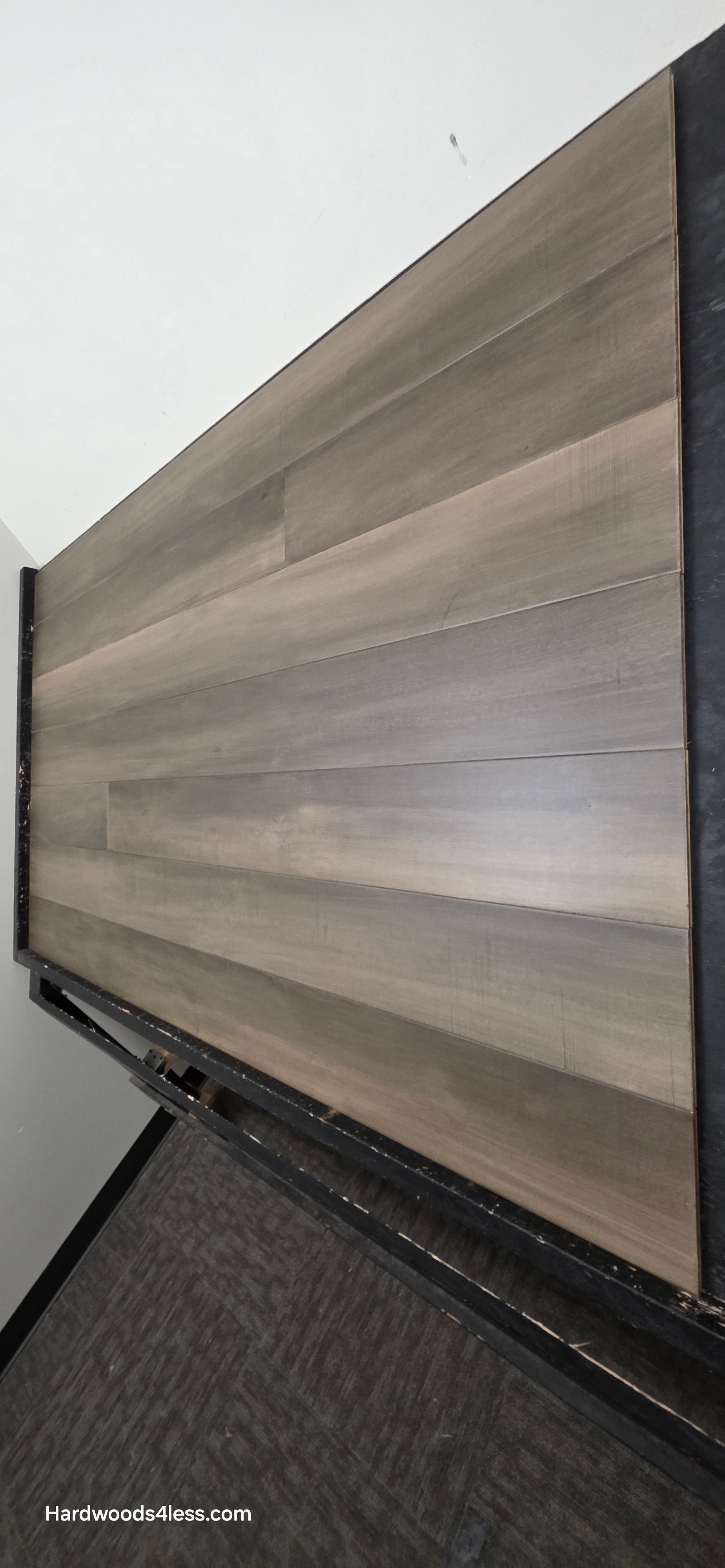 6 1/2" x 1/2" Engineered Maple Weathered Winter Hardwood Flooring. Shown on a black shooting table.