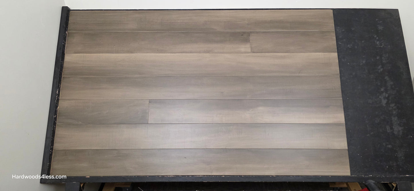 6 1/2" x 1/2" Engineered Maple Weathered Winter Hardwood Flooring. Shown on a black shooting table.