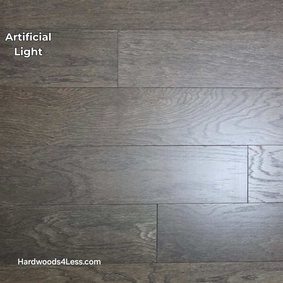 6 1/2" x 3/8" Engineered White Oak Nocturne Hardwood Flooring. Shown in artificial lighting.