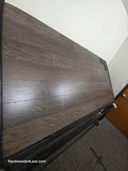6 1/2" x 3/8" Engineered White Oak Nocturne Hardwood Flooring. Shown on a black shooting table. Shot from steep left.