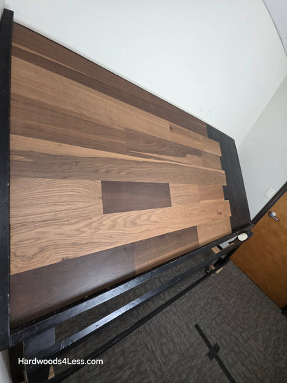 6 1/2" x 7/16" Engineered White Oak Wingham Hardwood Flooring. Shown on a black shooting table. Shot from steep left.