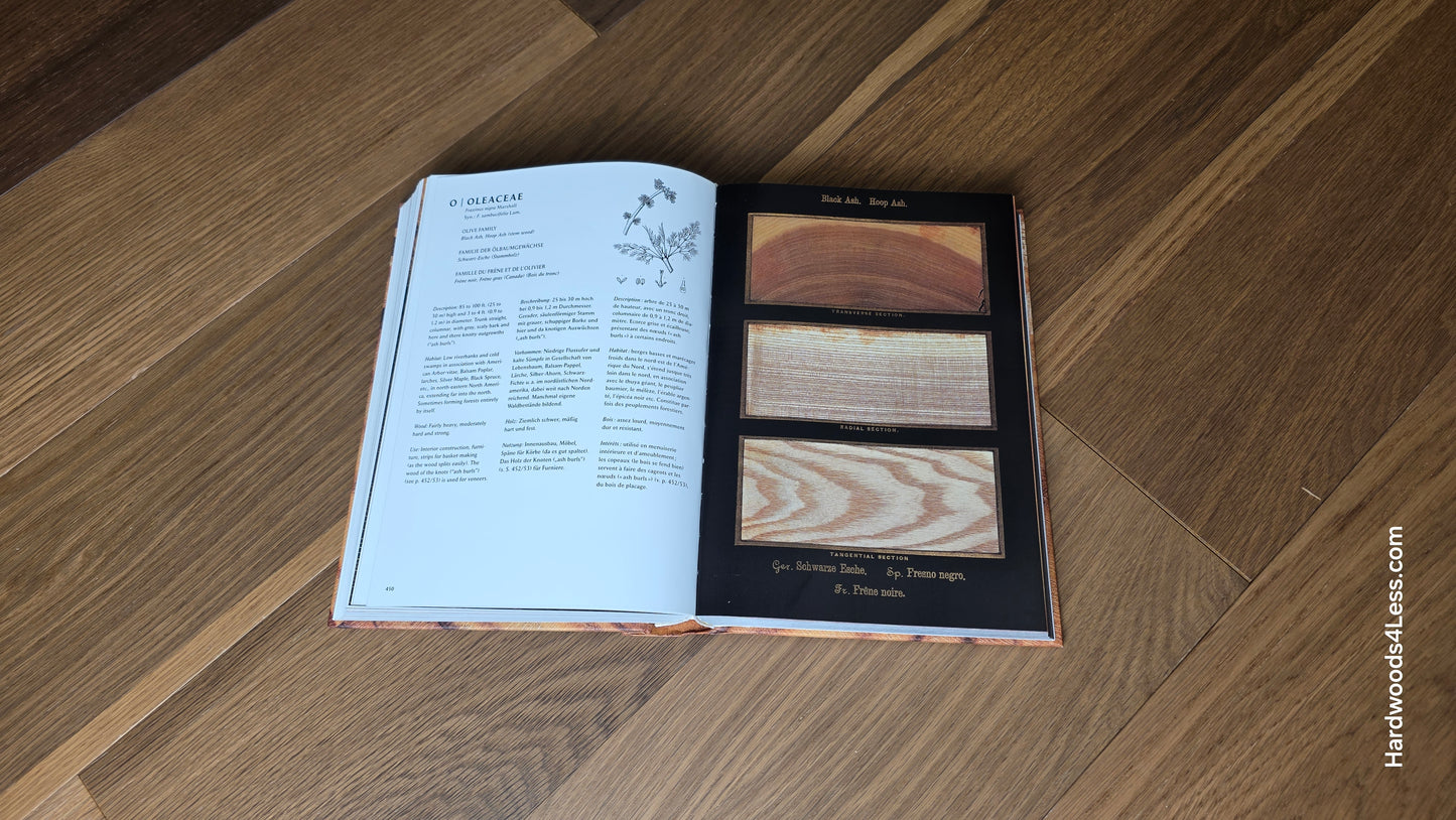 6 1/2" x 7/16" Engineered White Oak Wingham Hardwood Flooring. Shown in the center is a hardwood book. The book is resting on top of the engineered white oak flooring.