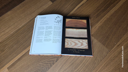 6 1/2" x 7/16" Engineered White Oak Wingham Hardwood Flooring. Shown in the center is a hardwood book. The book is resting on top of the engineered white oak flooring.