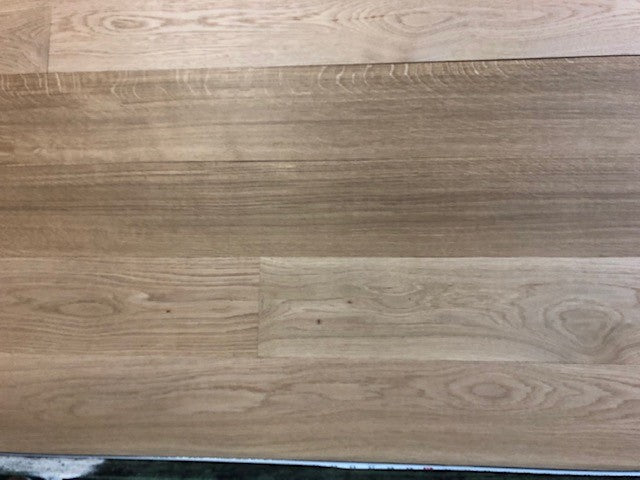 6" x 3/4" Unfinished White Oak Select & Better Solid Hardwood Flooring shown on a green shooting table 