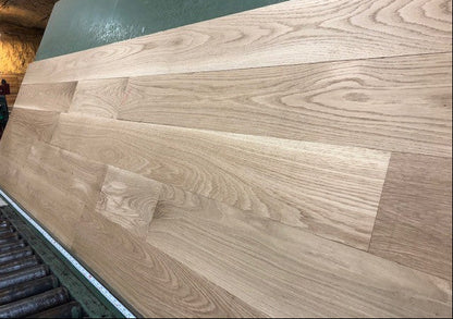 6" x 3/4" Unfinished White Oak Select & Better Solid Hardwood Flooring shown on a green shooting table 