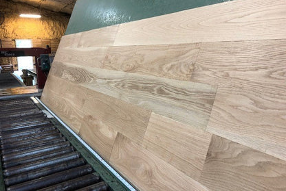 6" x 3/4" Unfinished White Oak Select & Better Solid Hardwood Flooring shown on a green shooting table 