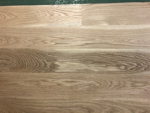 6" x 3/4" Unfinished White Oak Select & Better Solid Hardwood Flooring shown on a green shooting table 