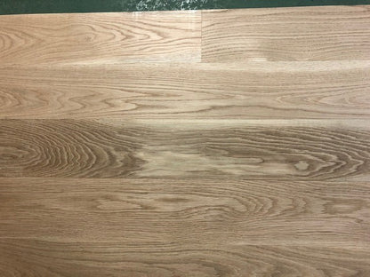 6" x 3/4" Unfinished White Oak Select & Better Solid Hardwood Flooring shown on a green shooting table 