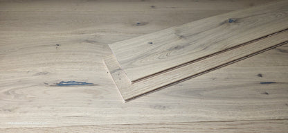 7 1/2" x 1/2" Engineered European White Oak Belleray Hardwood Flooring. Shown as 2 planks stacked on top of each other in the center of the Engineered flooring. 