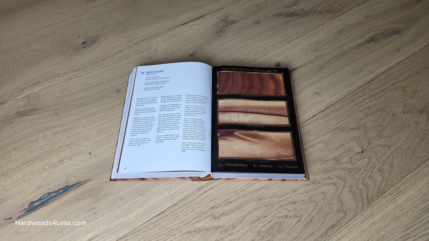 7 1/2" x 1/2" Engineered European White Oak Belleray Hardwood Flooring. Shown with a hardwood book. Sitting in the center on top of the Engineered White oak flooring.