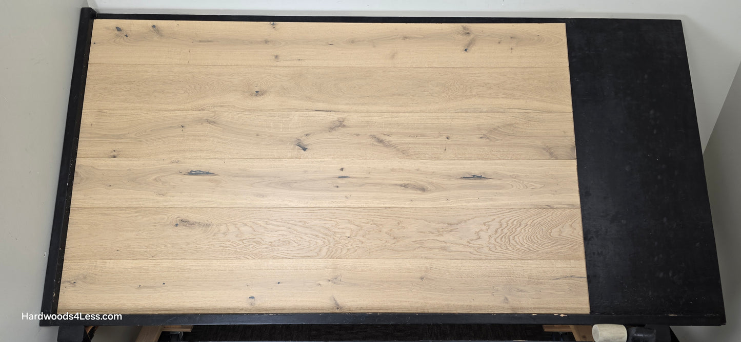 7 1/2" x 1/2" Engineered European White Oak Belleray Hardwood Flooring. Shown on a black shooting table. Shot from center.