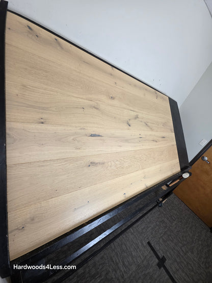 7 1/2" x 1/2" Engineered European White Oak Belleray Hardwood Flooring. Shown on a black shooting table. Shot from steep left. 