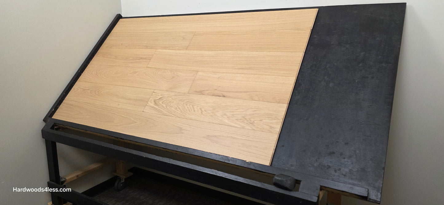 7 1/2" x 1/2" Engineered European White Oak Venice Hardwood Flooring. Shown on a black shooting table. Shot from wide right.