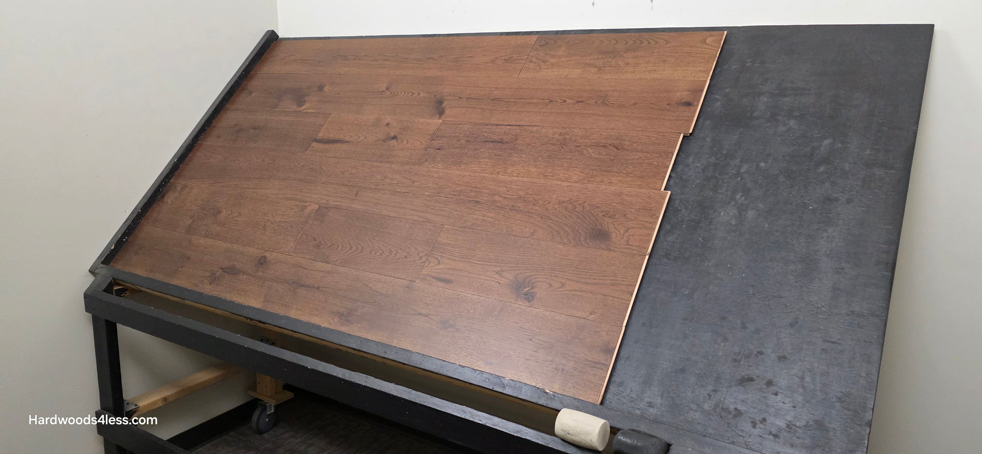 7 1/2" x 1/2" Engineered Hickory Mauna Kea Hardwood Flooring. Shown on a black shooting table. Shot from wide right.