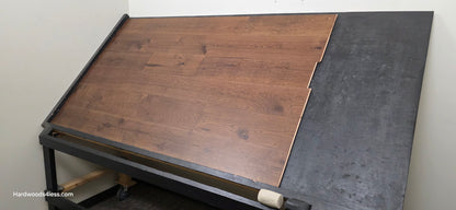 7 1/2" x 1/2" Engineered Hickory Mauna Kea Hardwood Flooring. Shown on a black shooting table. Shot from wide right.
