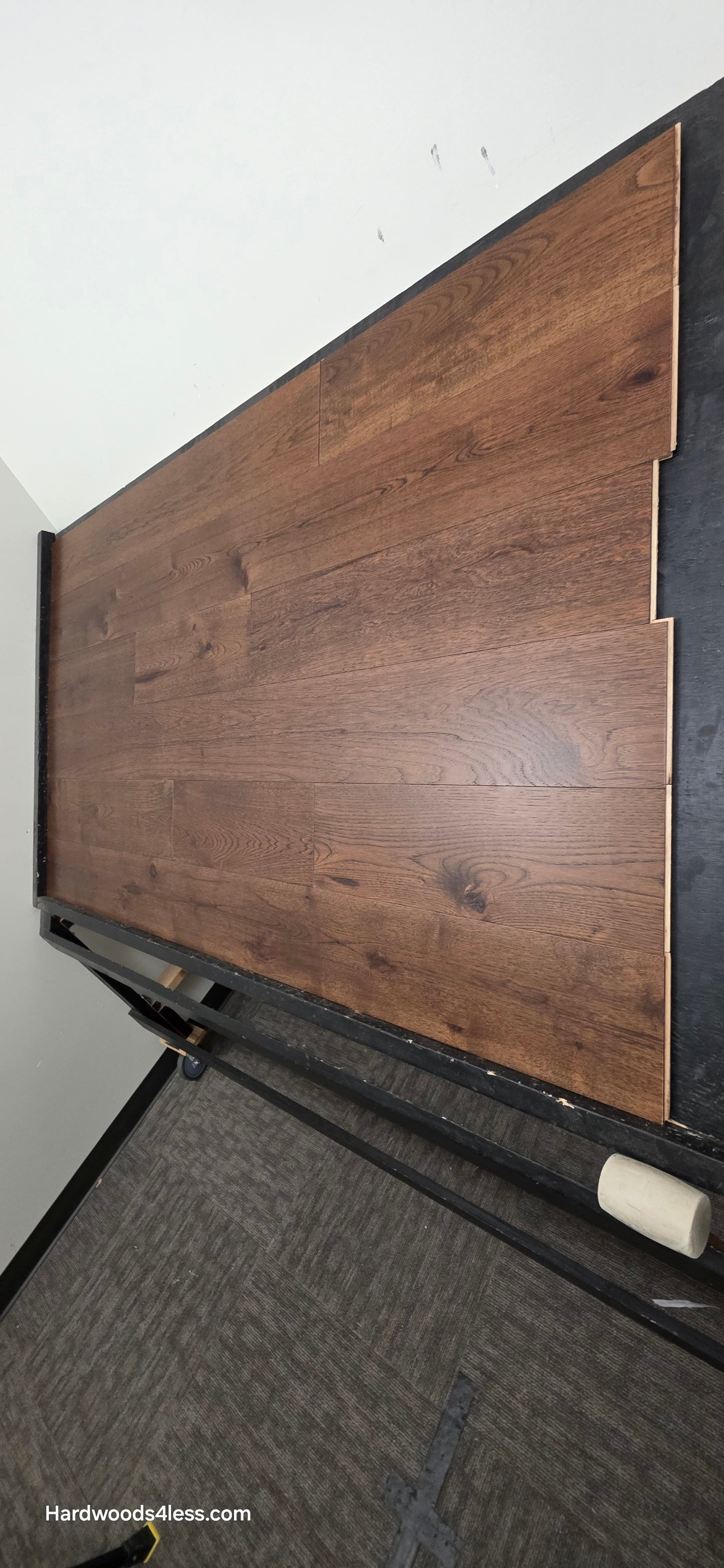 7 1/2" x 1/2" Engineered Hickory Mauna Kea Hardwood Flooring. Shown on a black shooting table. Shot from steep right.