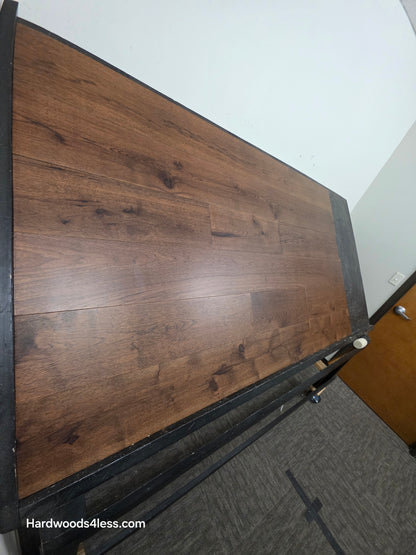 7 1/2" x 1/2" Engineered Hickory Mauna Kea Hardwood Flooring. Shown on a black shooting table. Shot from steep left. 
