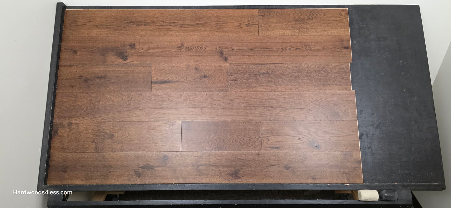 7 1/2" x 1/2" Engineered Hickory Mauna Kea Hardwood Flooring. Shown on a black shooting table. Shot from center.
