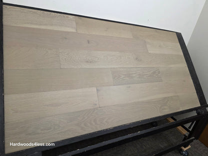 7 1/2" x 9/16" Engineered European Oak Alderney Hardwood Flooring shown on a black shooting table. Left hand side.