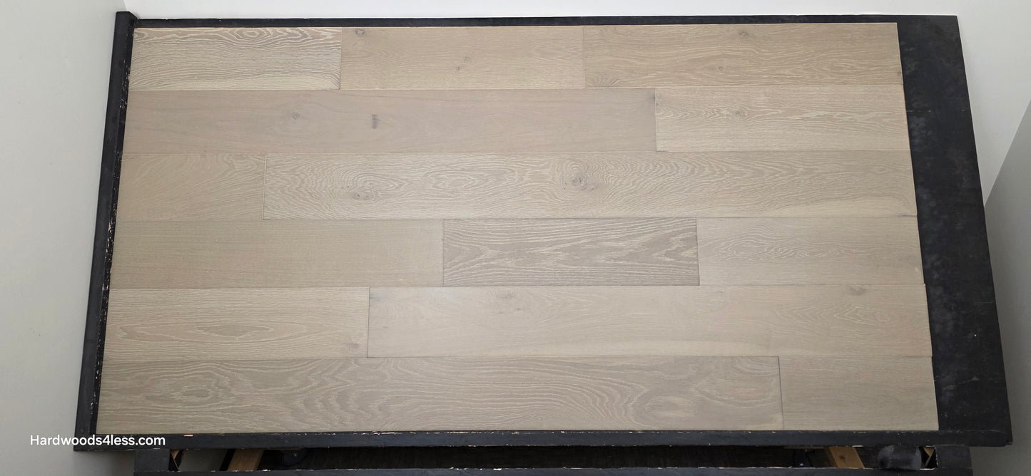 7 1/2" x 9/16" Engineered European Oak Alderney Hardwood Flooring shown on a black shooting table