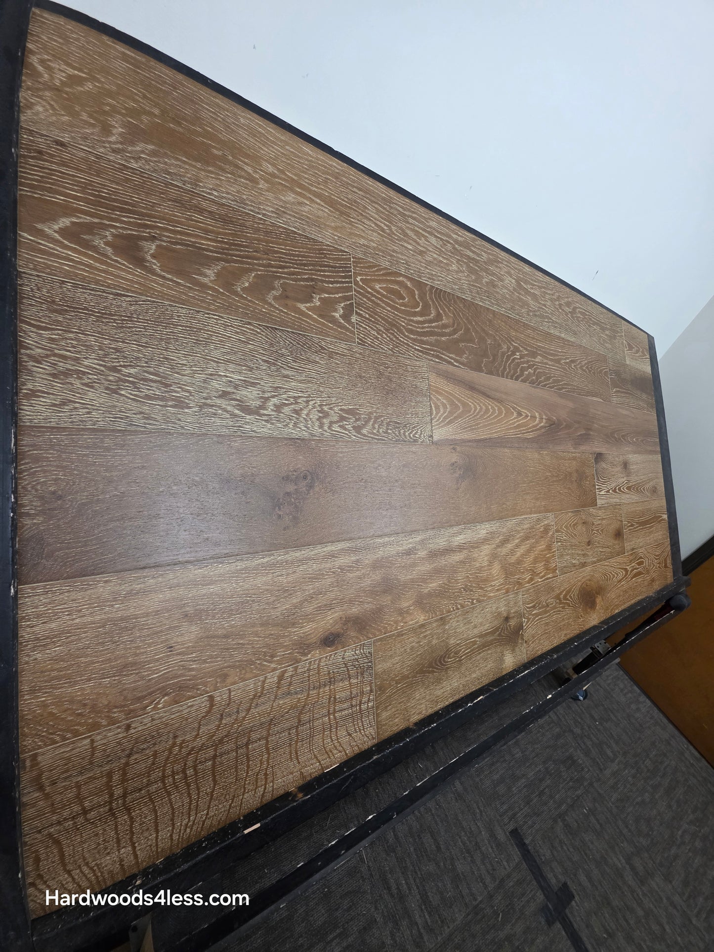 7 1/2" x 9/16" Engineered European Oak Hayling Hardwood Flooring. Shown on a black shooting table from the right side. 