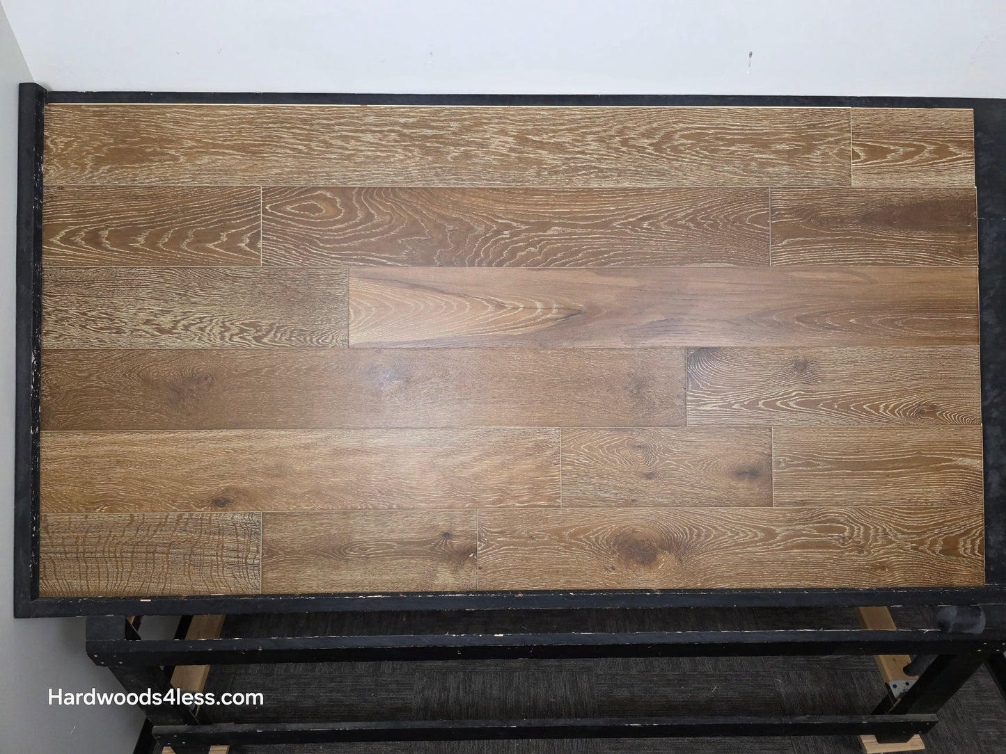 7 1/2" x 9/16" Engineered European Oak Hayling Hardwood Flooring. Shown on a black shooting table. 