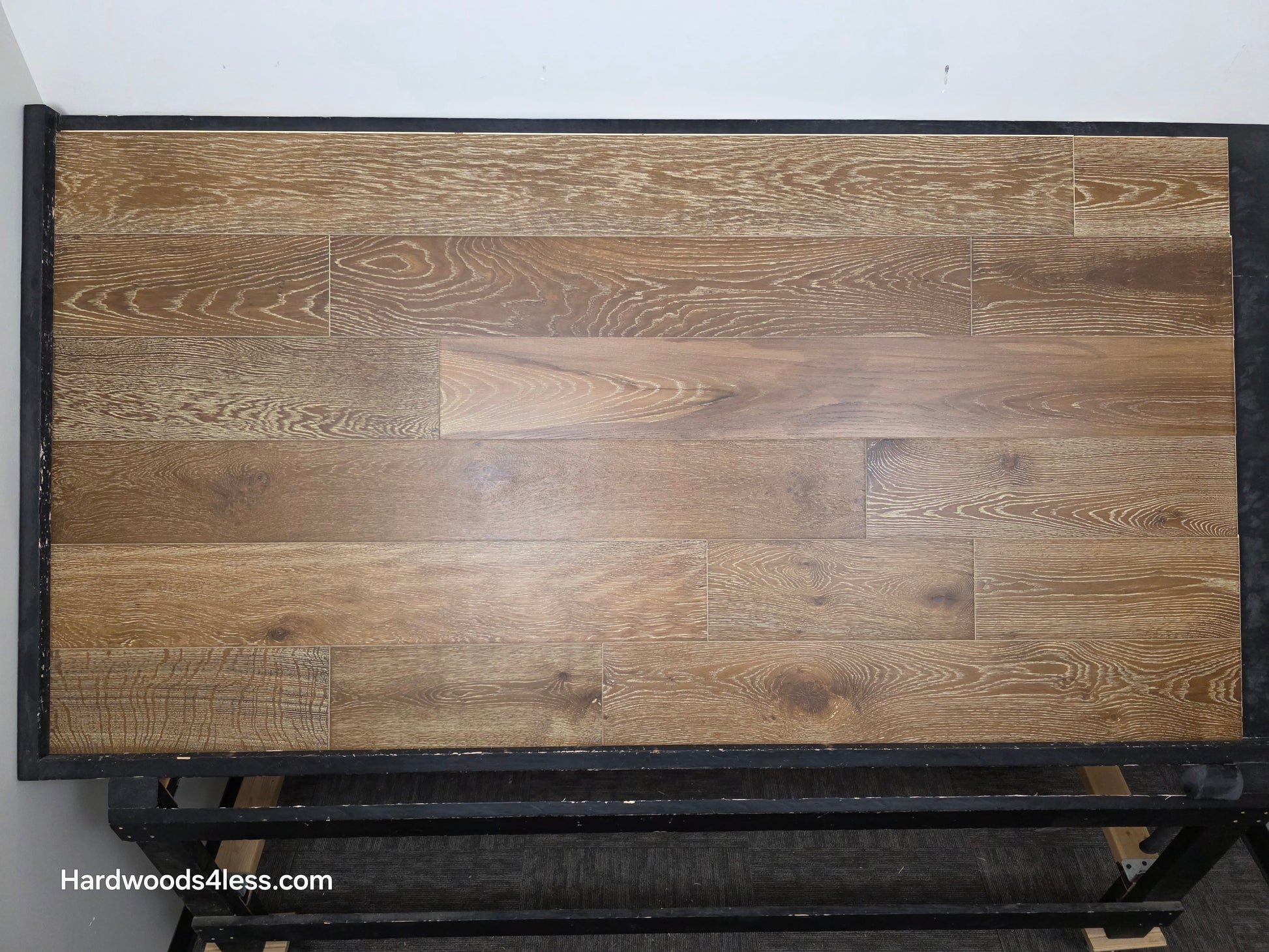 7 1/2" x 9/16" Engineered European Oak Hayling Hardwood Flooring. Shown on a black shooting table. 