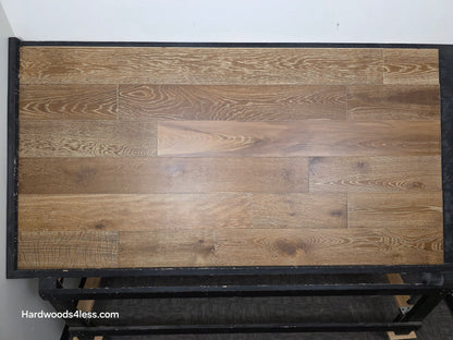 7 1/2" x 9/16" Engineered European Oak Hayling Hardwood Flooring. Shown on a black shooting table. 