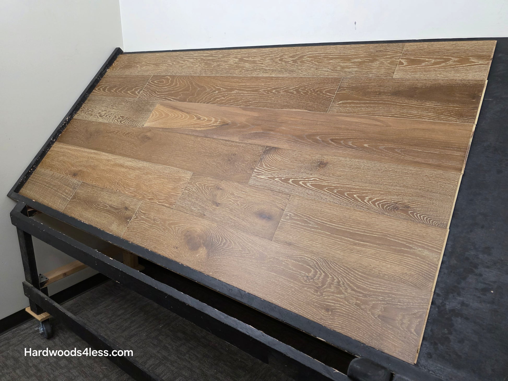 7 1/2" x 9/16" Engineered European Oak Hayling Hardwood Flooring. Shown on a black shooting table right side shot.