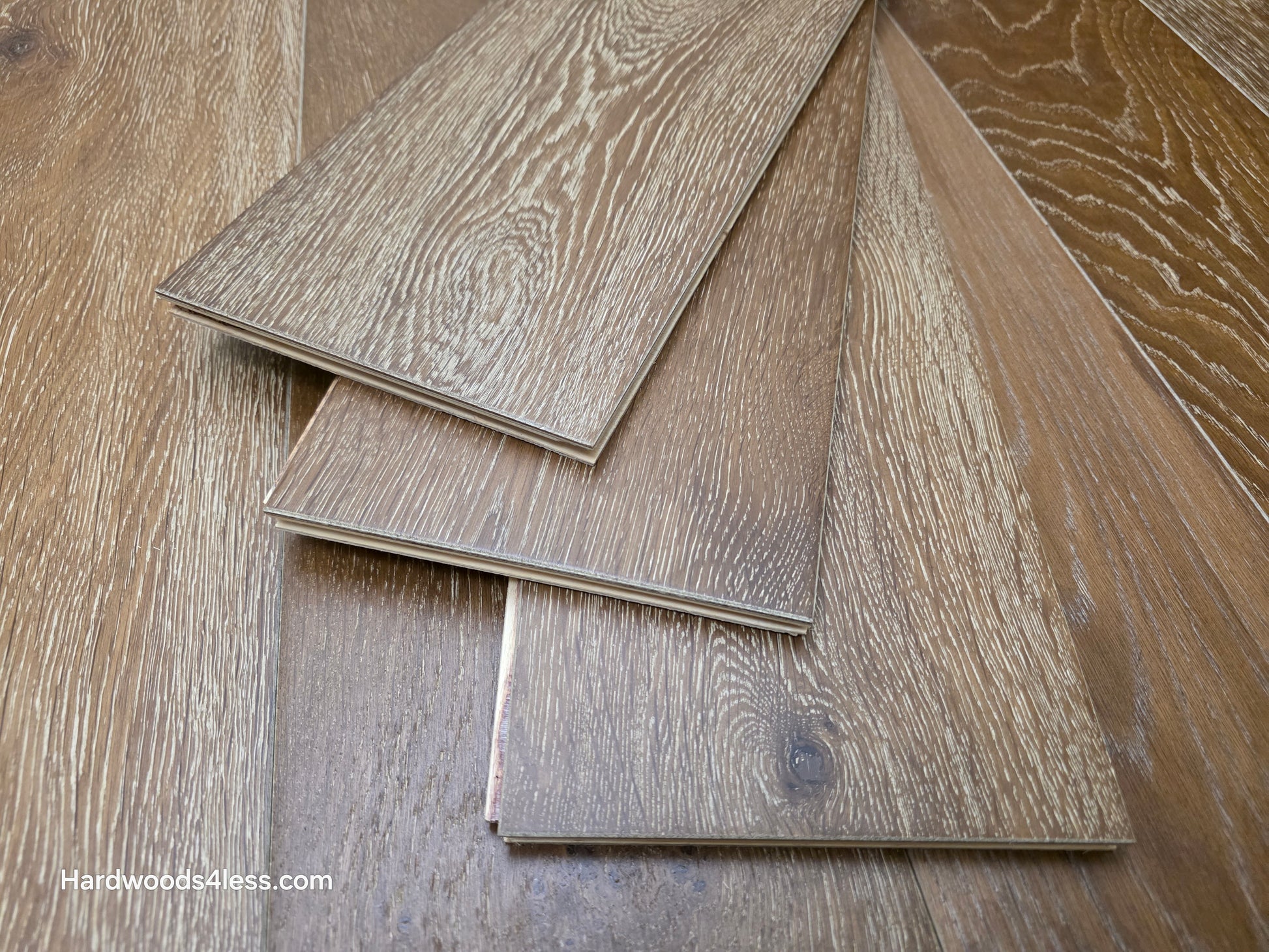 7 1/2" x 9/16" Engineered European Oak Hayling Hardwood Flooring. Shown with three tiles stacked atop on another.